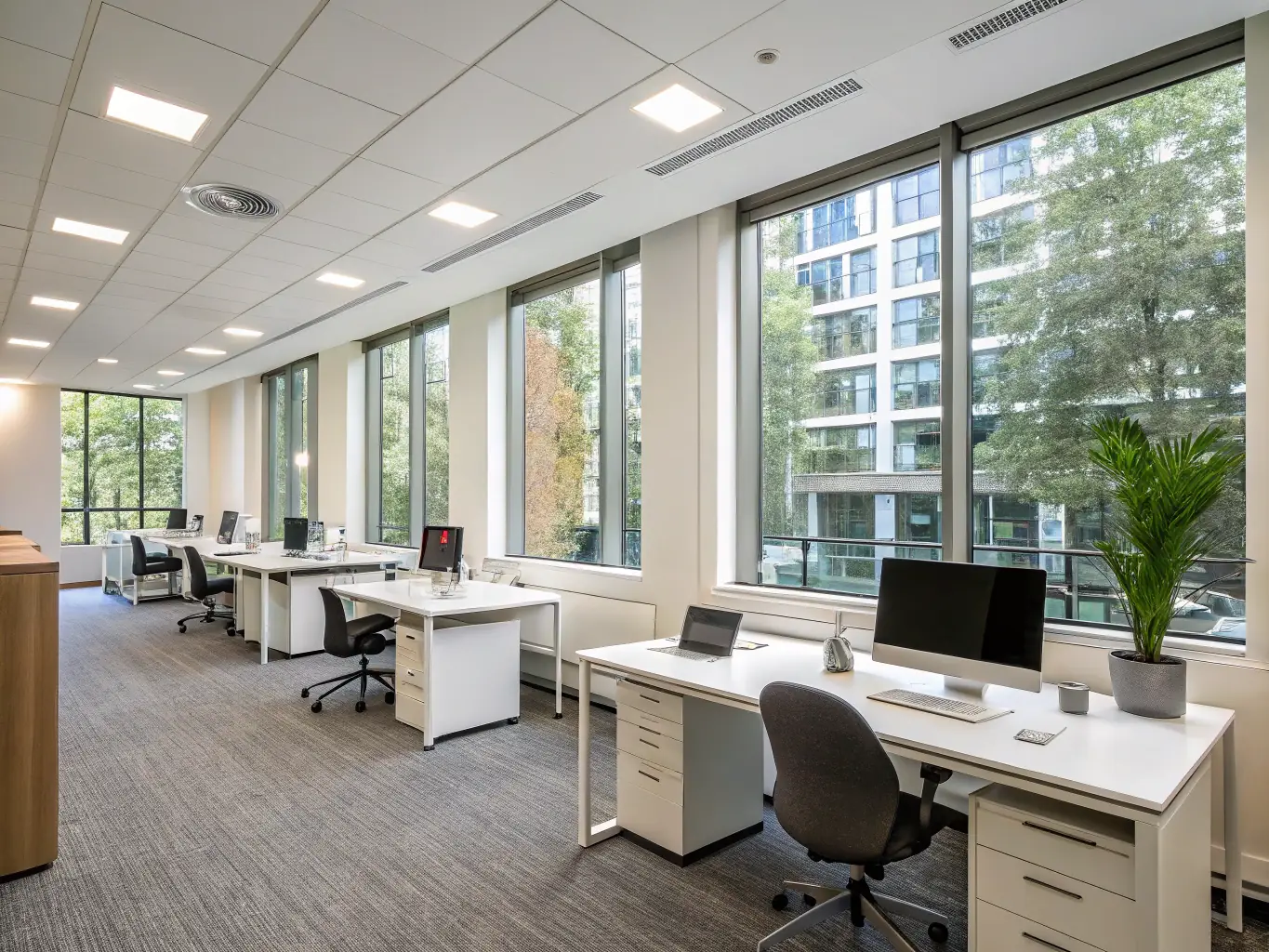 A modern office space with clean desks, organized workstations, and a pristine reception area, reflecting a professional and productive atmosphere.